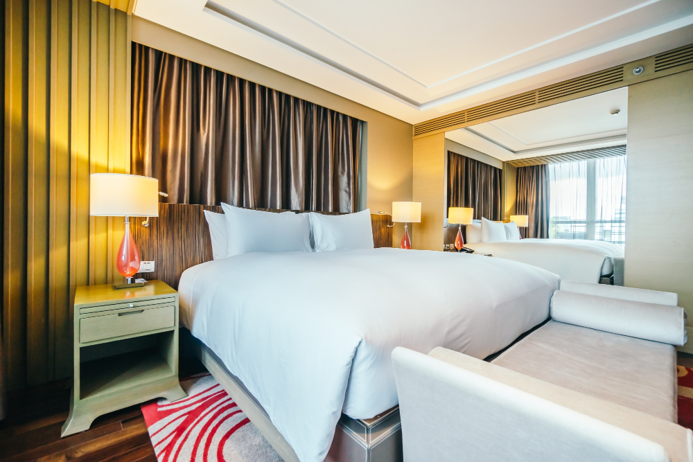 An aircraft on the runway and a comfortable hotel room