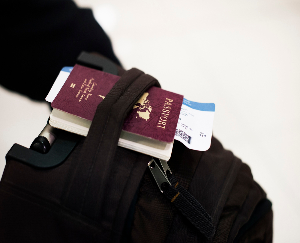 A passport with travel insurance documents